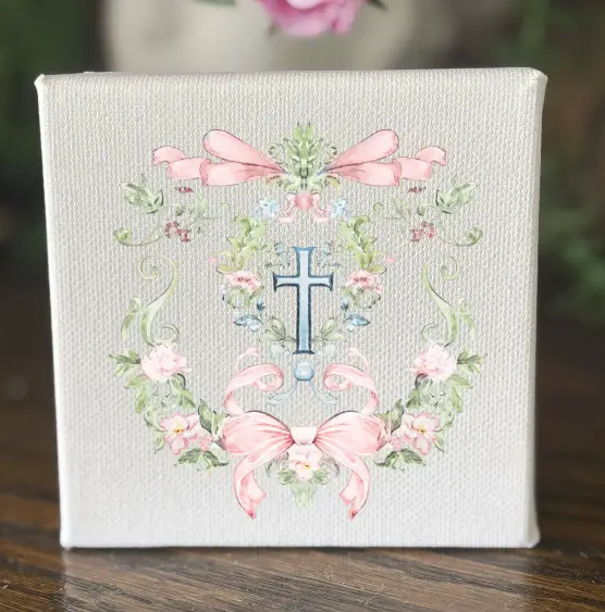 Decorative canvas with floral design and cross