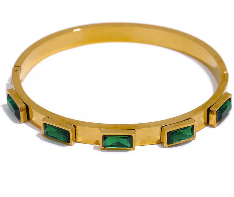 Gold bracelet with green gemstones