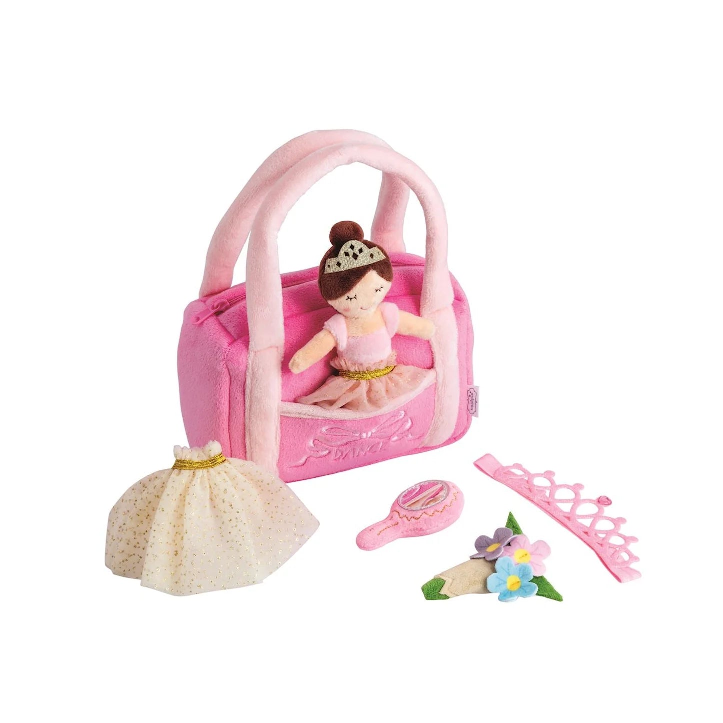 Pink toy purse with a doll, brush, comb, and accessories
