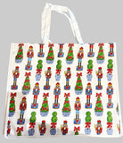 Tote bag with Christmas-themed design featuring nutcrackers and trees