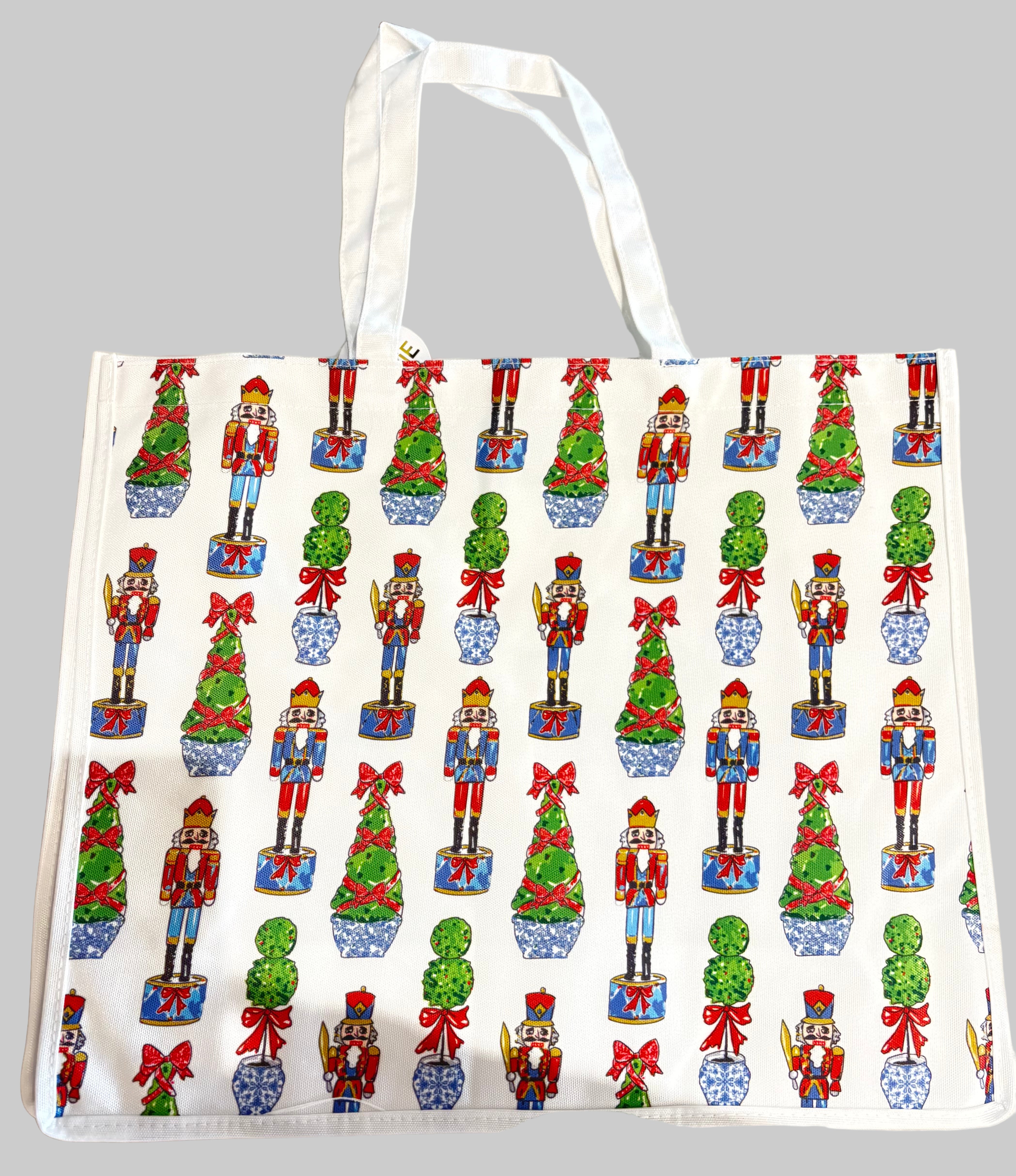 Tote bag with Christmas-themed design featuring nutcrackers and trees