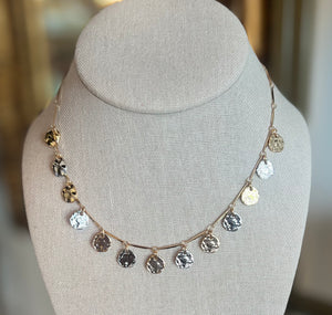 Necklace with circular gold and silver pendants 