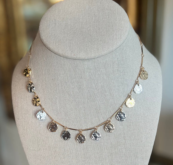 Necklace with circular gold and silver pendants 