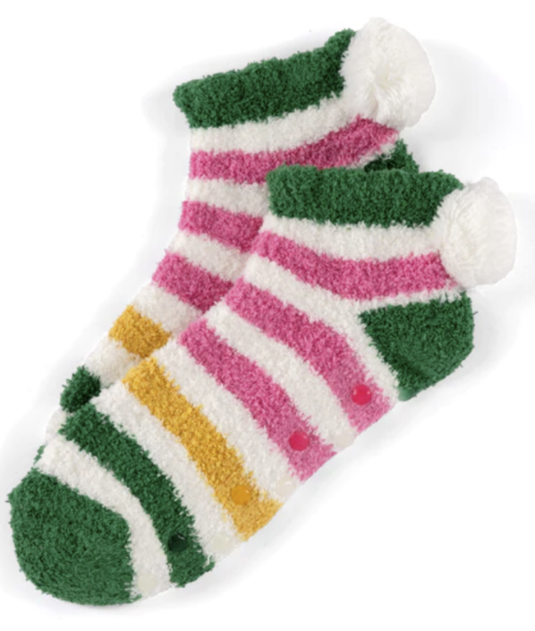 A pair of fuzzy green socks with multi-colored stripes and pompom heel detail
