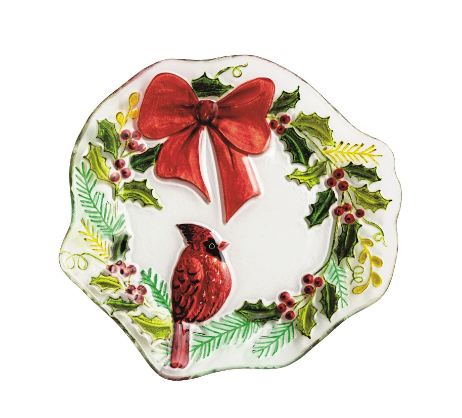 Decorative plate with a red cardinal, bow, and holly design 