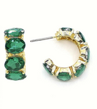 Gold hoop earrings with green gemstones 