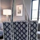 Navy quilted tote bag with white floral pattern 