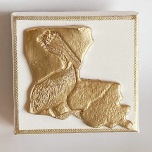 Louisiana Gold embossed design with a pelican engraved 