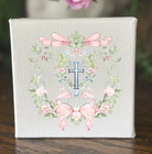 Decorative canvas with floral design and cross 