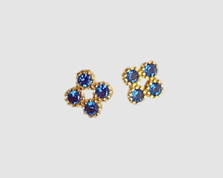 Pair of gold earrings with blue gemstones 