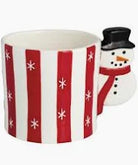 Mug with snowman handle and red and white striped pattern