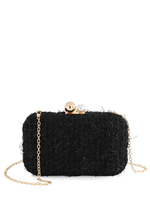 Black textured clutch bag with gold chain and pearl embellishments 