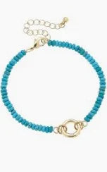 Turquoise beaded charm bracelet with a gold clasp