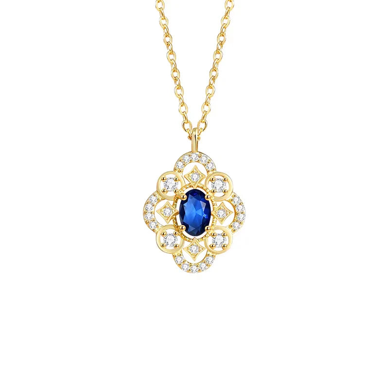 Aubrey Adele Gold necklace with a blue gemstone pendant 