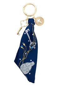 Keychain with blue fabric keychain with charms.