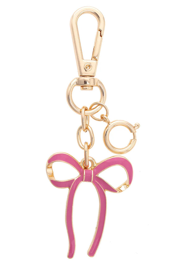 Gold keychain with a pink bow charm 