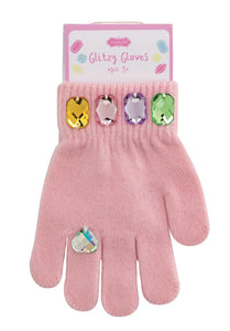 Three pairs of glittery gloves in pink, white, and black with colorful gems.