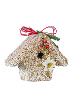 Birdseed house shaped like a birdhouse with magnolia flower