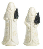 Santa sitter made of milk glass holding a tree and snowflake